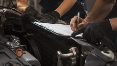 mechanics inspecting car