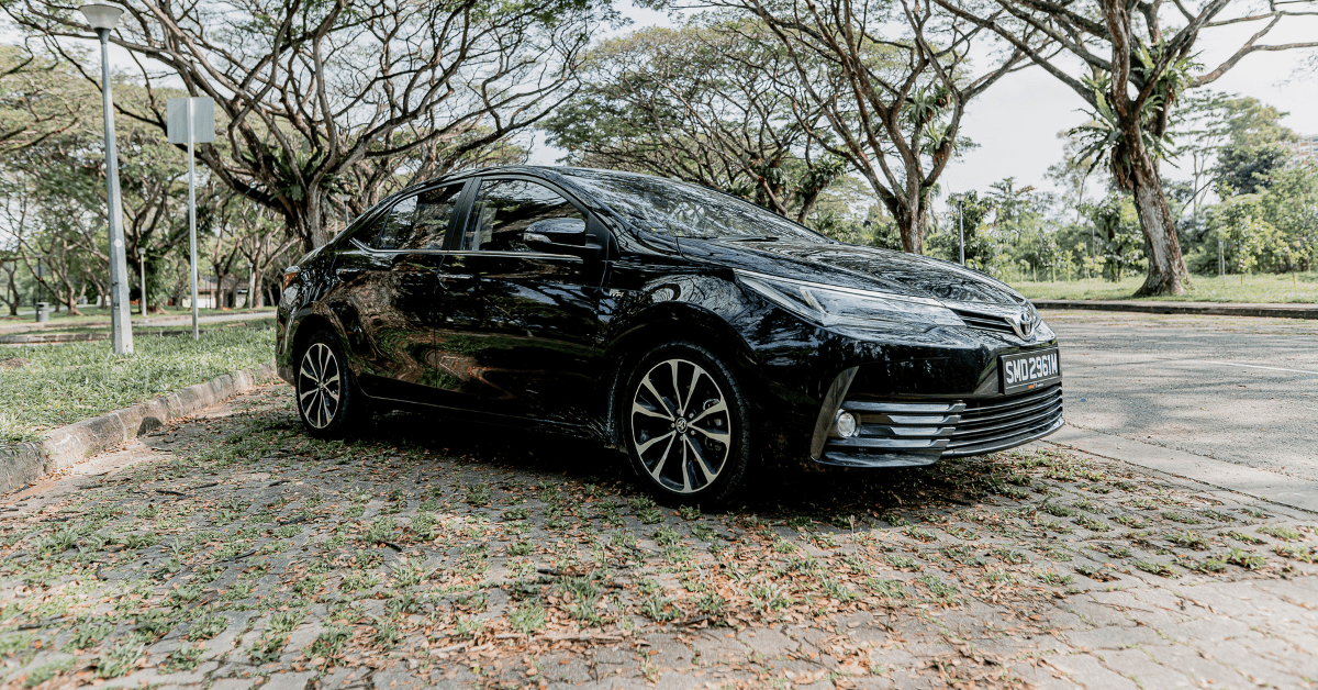 Pre-owned Toyota Altis parked in an open air carpark
