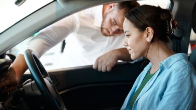 Car dealer shows woman car dashboard