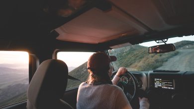 woman driving next to cliff